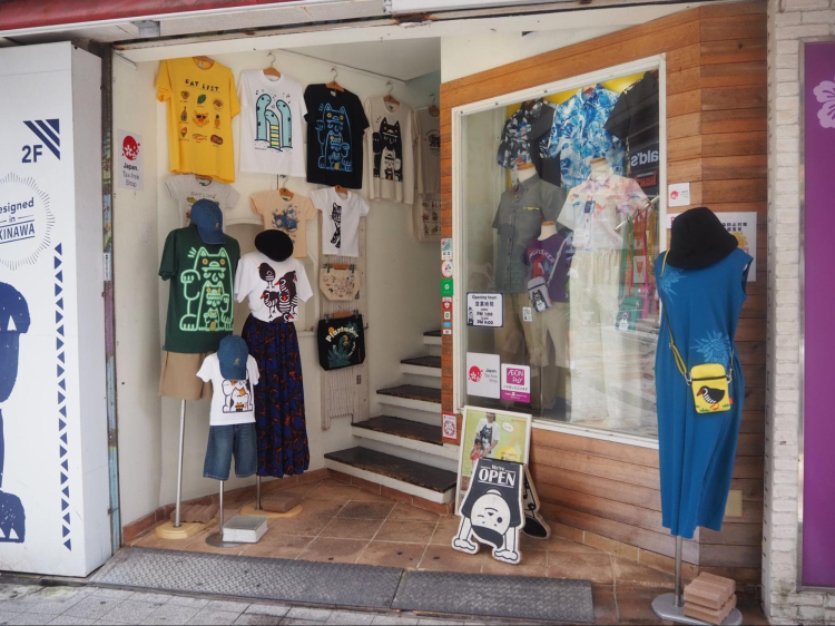 At the entrance to the store, you are greeted by colorful T-shirts.