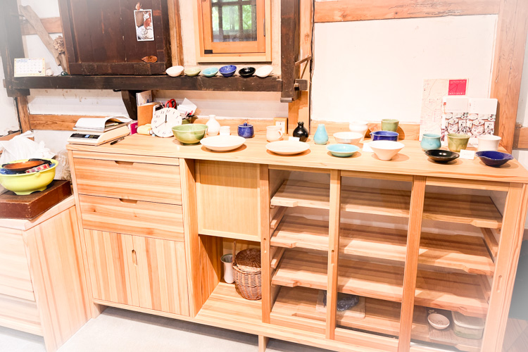 A shelf displaying examples of pottery making