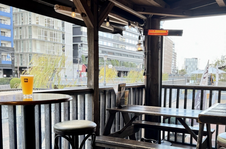 Enjoying craft beer on a pleasant riverside terrace is the best