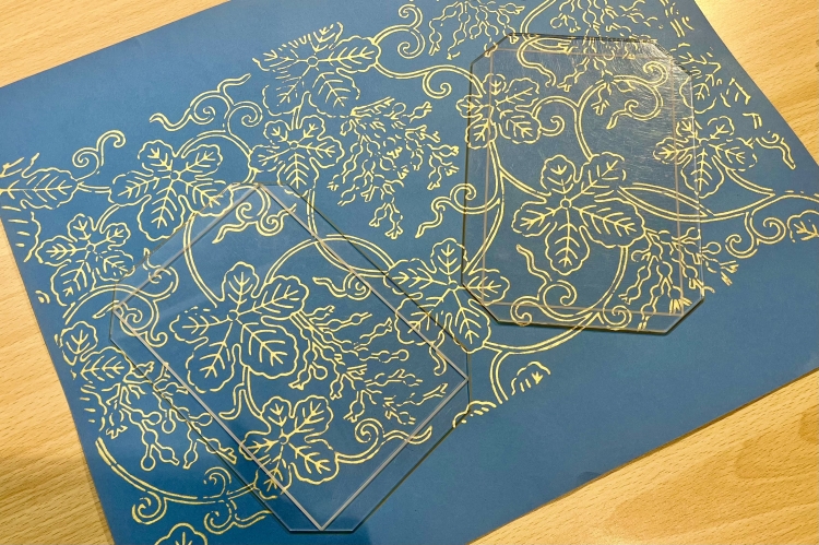 Cutting out the cover of the goshuincho to fit the frame