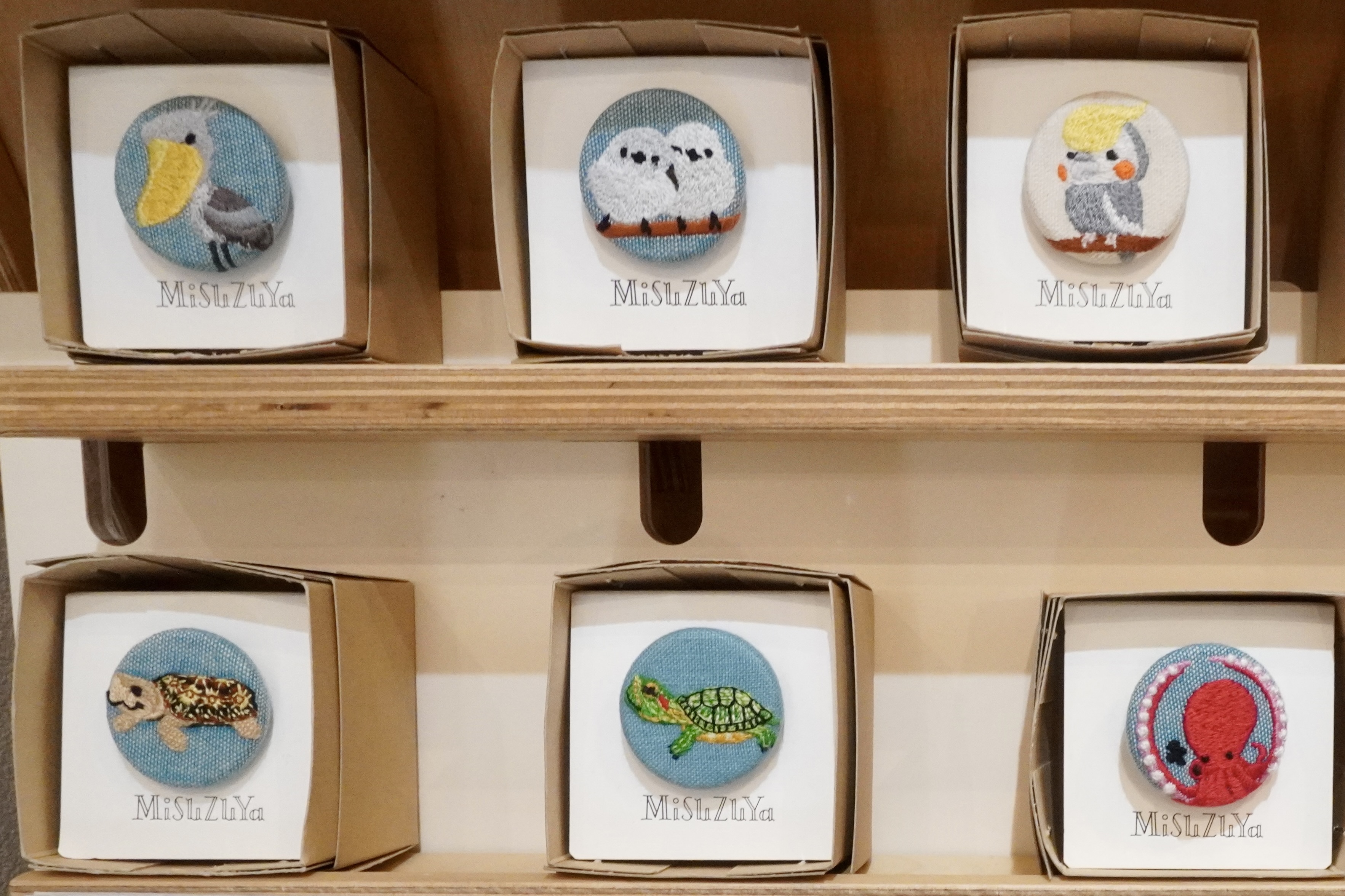 A shop specializing in warm and inviting "walnut buttons" found in a downtown shopping street.