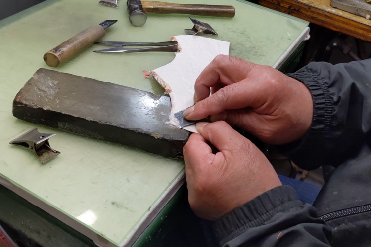 The process of skiving leather to maintain a consistent thickness. This is an important step that tests the craftsman's skill.
