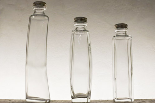 A transparent glass bottle filled with care