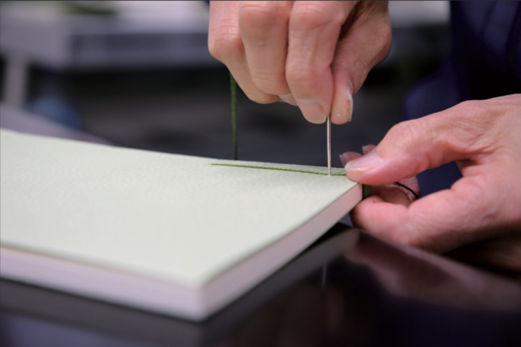 "Watoji" is a traditional Japanese bookbinding method where books are bound together carefully stitch by stitch.