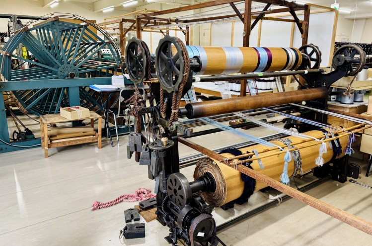 The factory contains more than 15 machines, including looms.