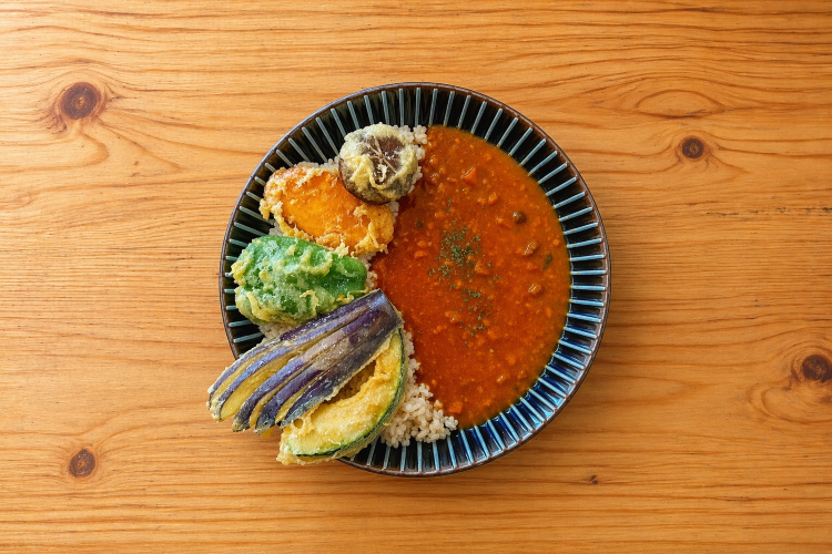 The "Vegetable Tempura Curry," with its emphasis on vibrant colors, is visually appealing as well.