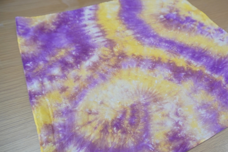 A furoshiki (wrapping cloth) finished with purple and yellow dyes.