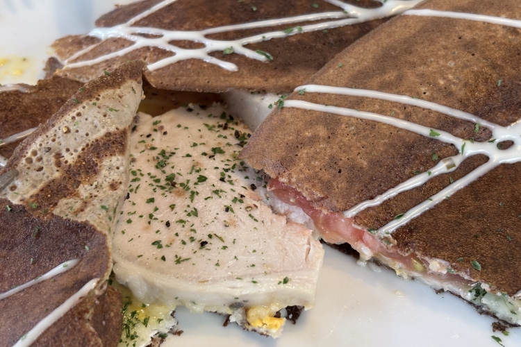 The crispy crust is filled with a generous portion of homemade ham.