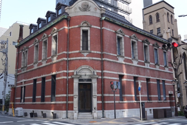 The building's exterior is striking with its red brick.