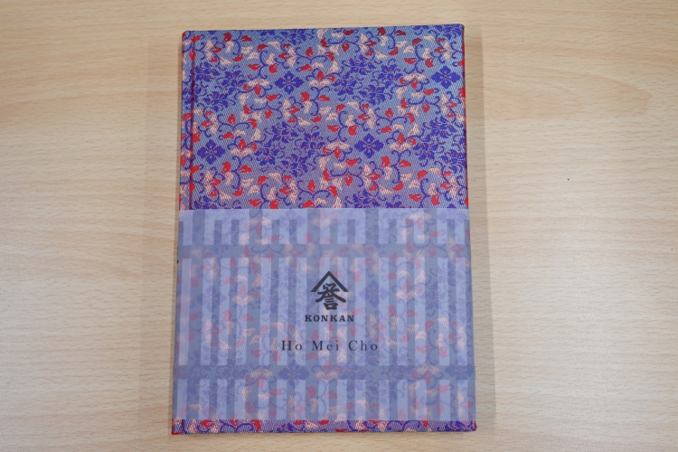 A high-end notebook, "Hōmeichō," adorned with Kyoto's brocade fabric.
