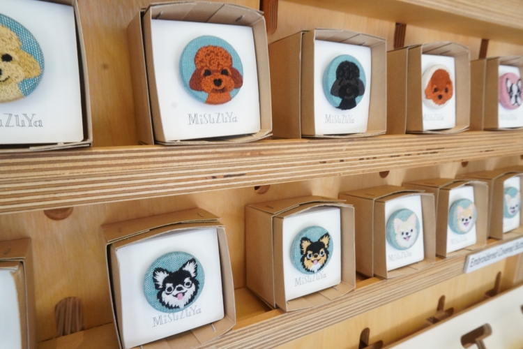 These adorable dog-shaped walnut buttons are also a perennially popular item.