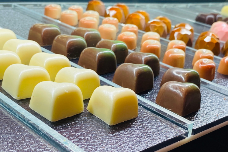 Truffle chocolates lined up in the display case