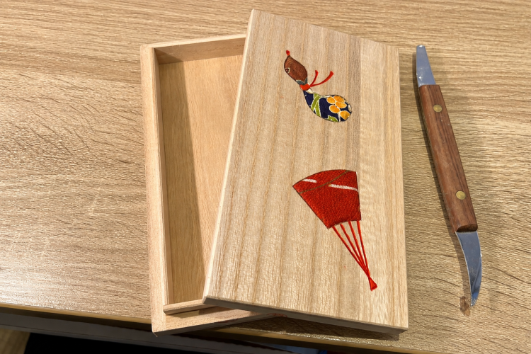 The fabric is glued and then pressed into the groove with a special spatula to complete the process.