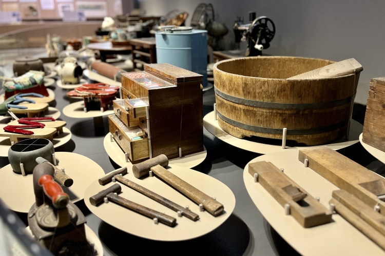 A wide variety of tools are on display, from craftsman's tools to everyday household items.